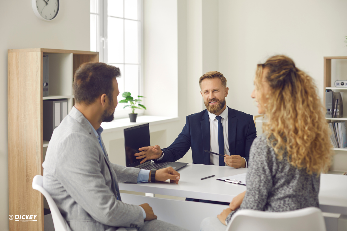 Couple meeting with property insurance agent.